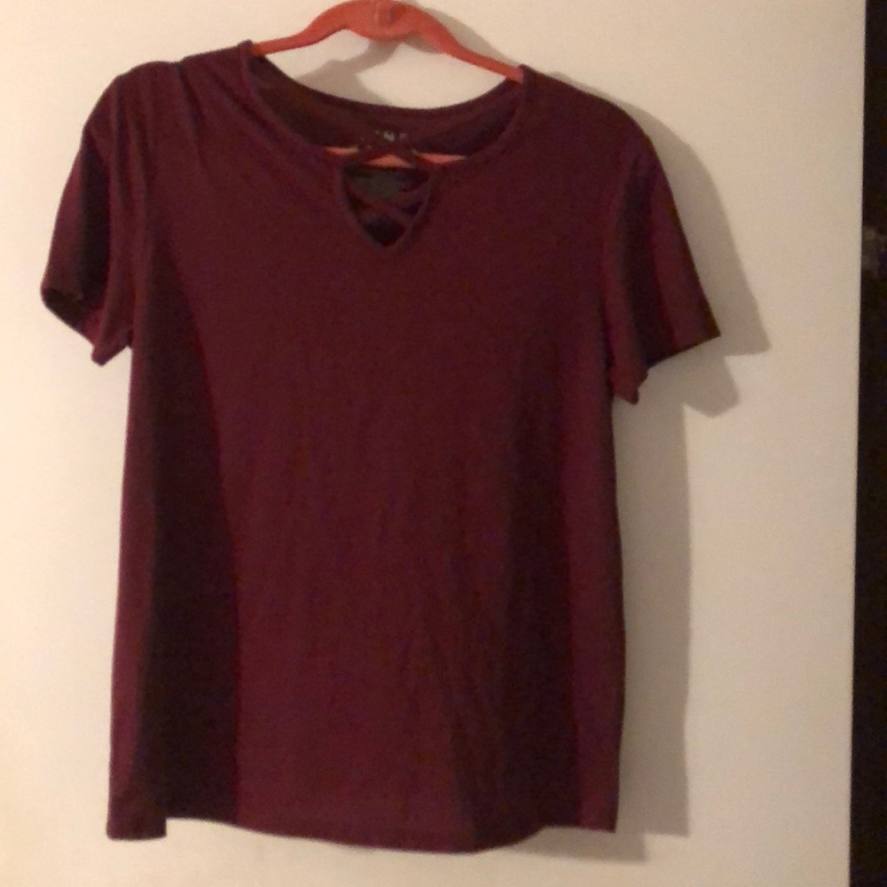 Burgundy shirt with crisscross cutout at neckline